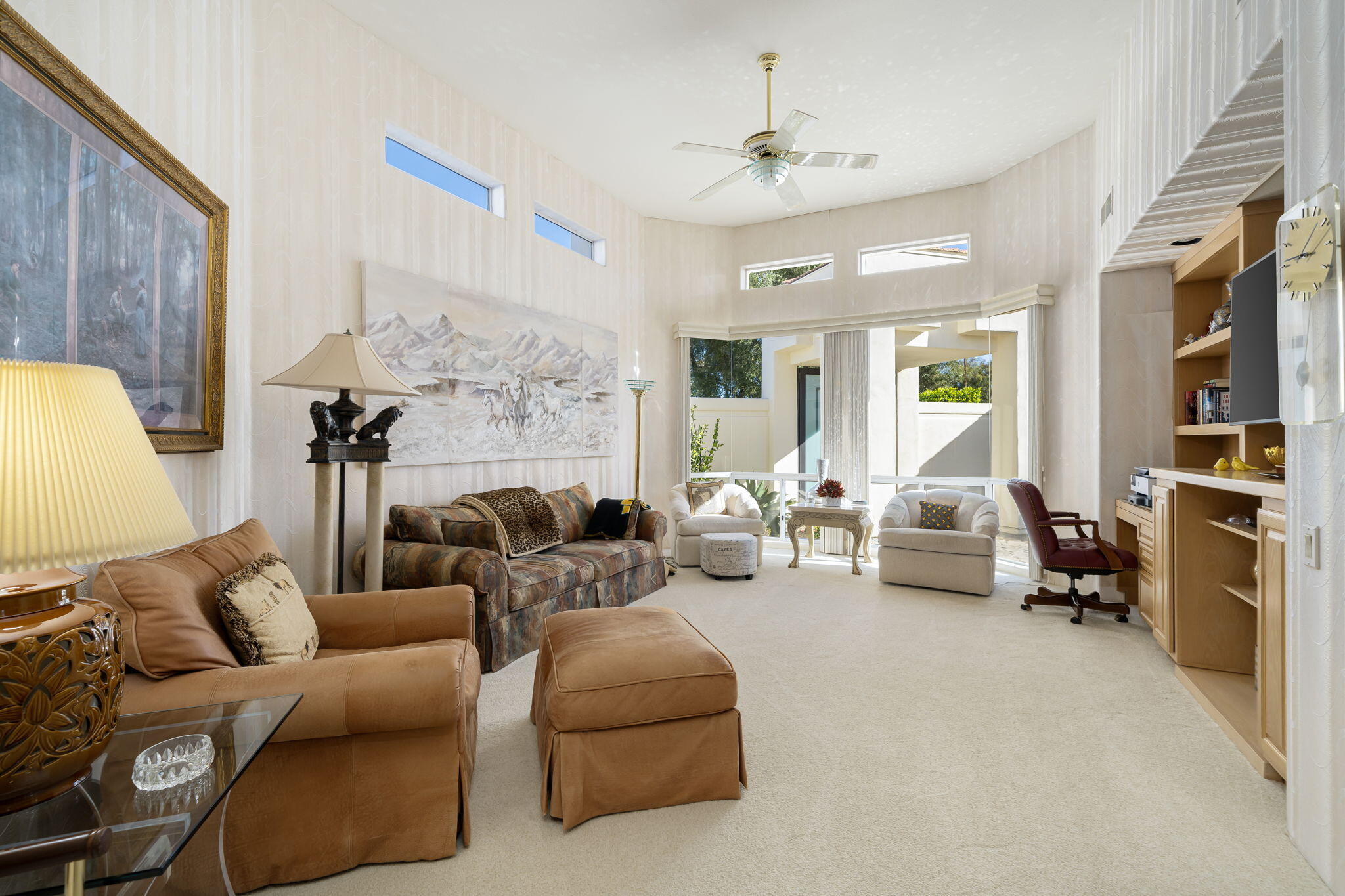 75315 St Andrews Court Indian Wells, CA 92210 - Photo 31 of 48 a living room with furniture and a chandelier