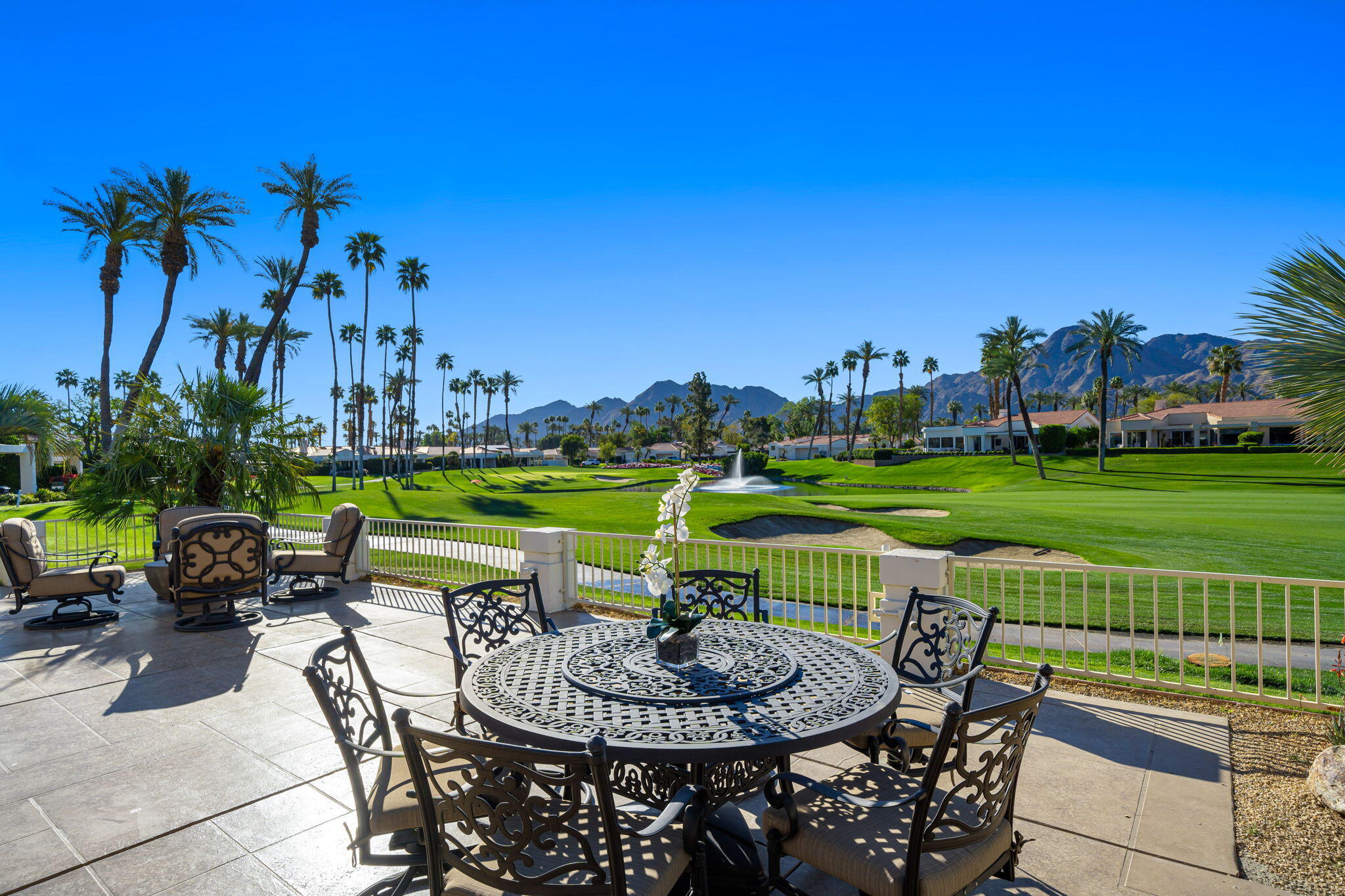 75315 St Andrews Court Indian Wells, CA 92210 - Photo 39 of 48 a view of a swimming pool and outdoor seating