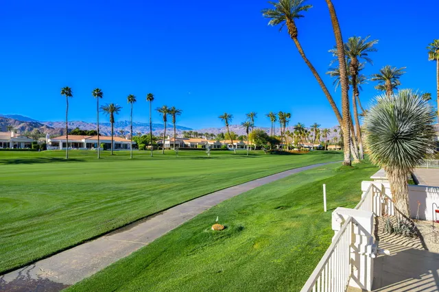 a view of a golf course with a big yard
