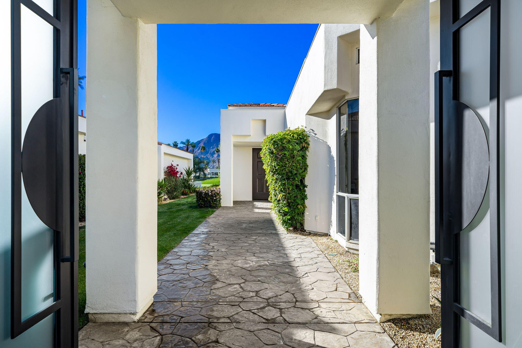 75315 St Andrews Court Indian Wells, CA 92210 - Photo 8 of 48 a view of a entryway door front of house