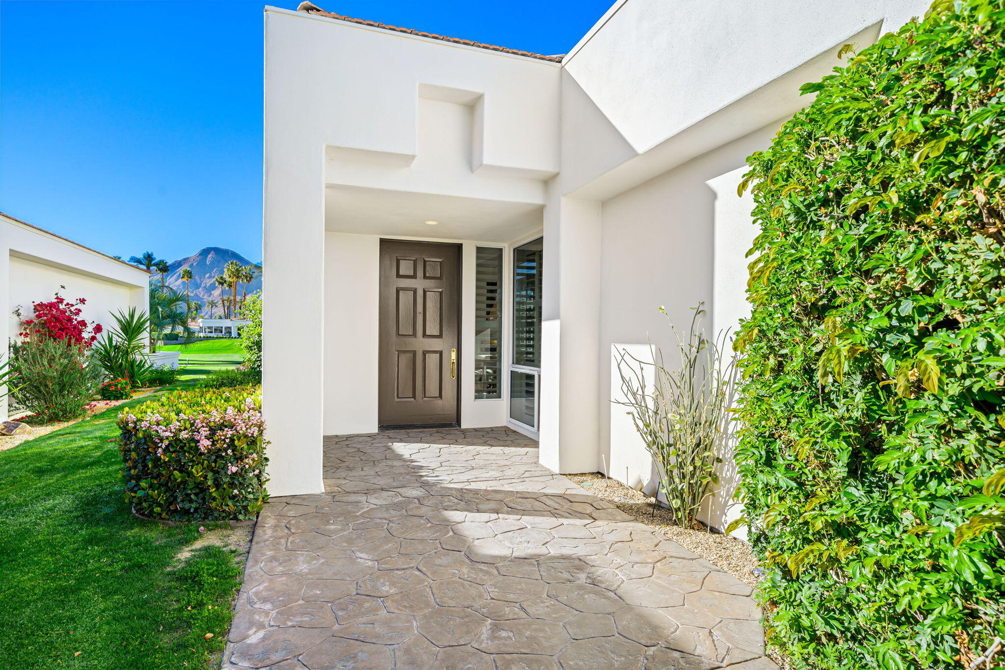 75315 St Andrews Court Indian Wells, CA 92210 - Photo 9 of 48 a front view of a house with a porch