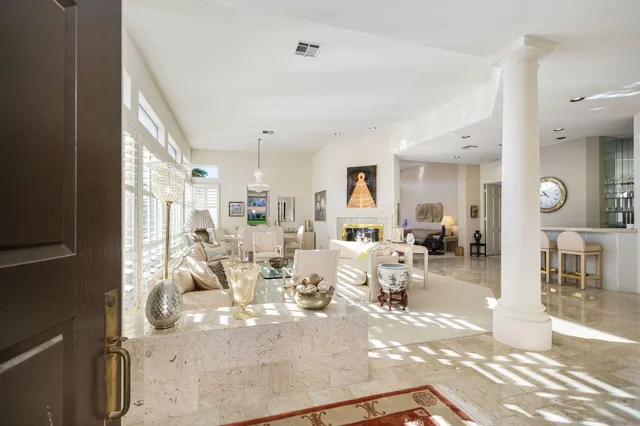 a view of a living room and dining room