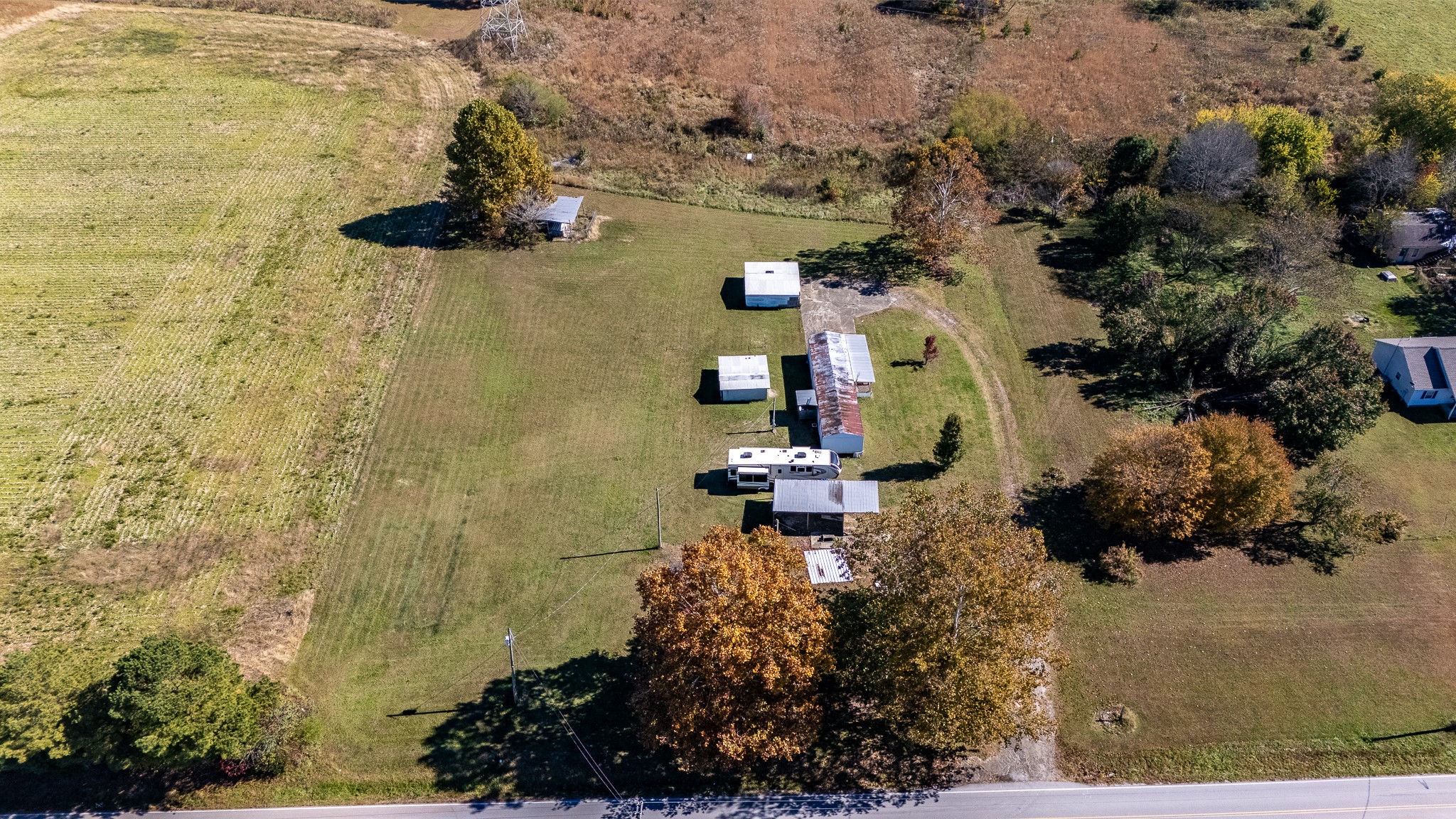 an aerial view of a house with a yard and garden