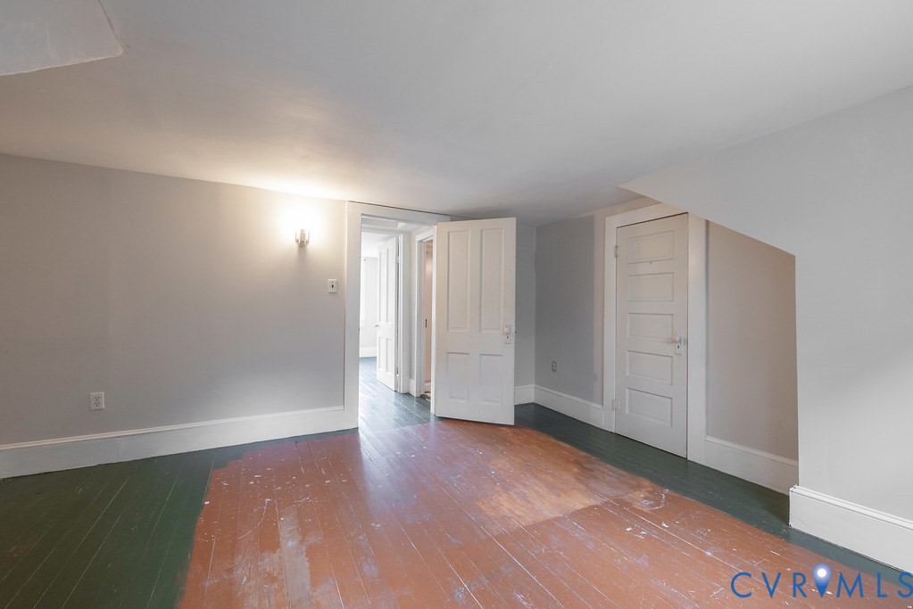1881 Fairport Road Reedville, VA 22539 - Photo 33 of 54 Exposed wood flooring, painted white trim, white p
