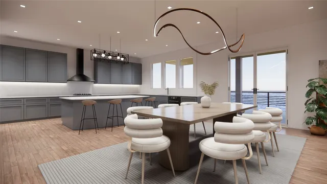 a kitchen with a dining table chairs and a sink