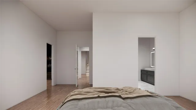 a bedroom with a bed and a flat tv screen