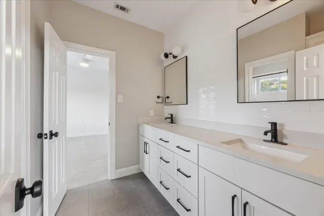 an empty room with a empty space and a ceiling fan