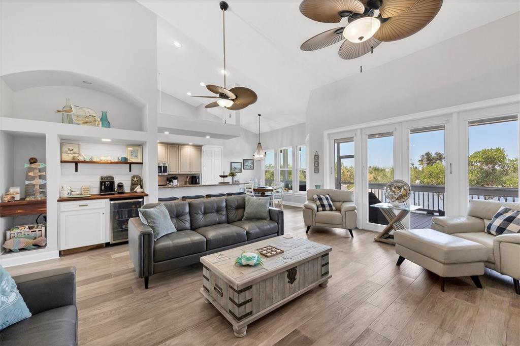 71 North Gulf Boulevard Placida, FL 33946 - Photo 19 of 52 a living room with furniture kitchen view and a large window
