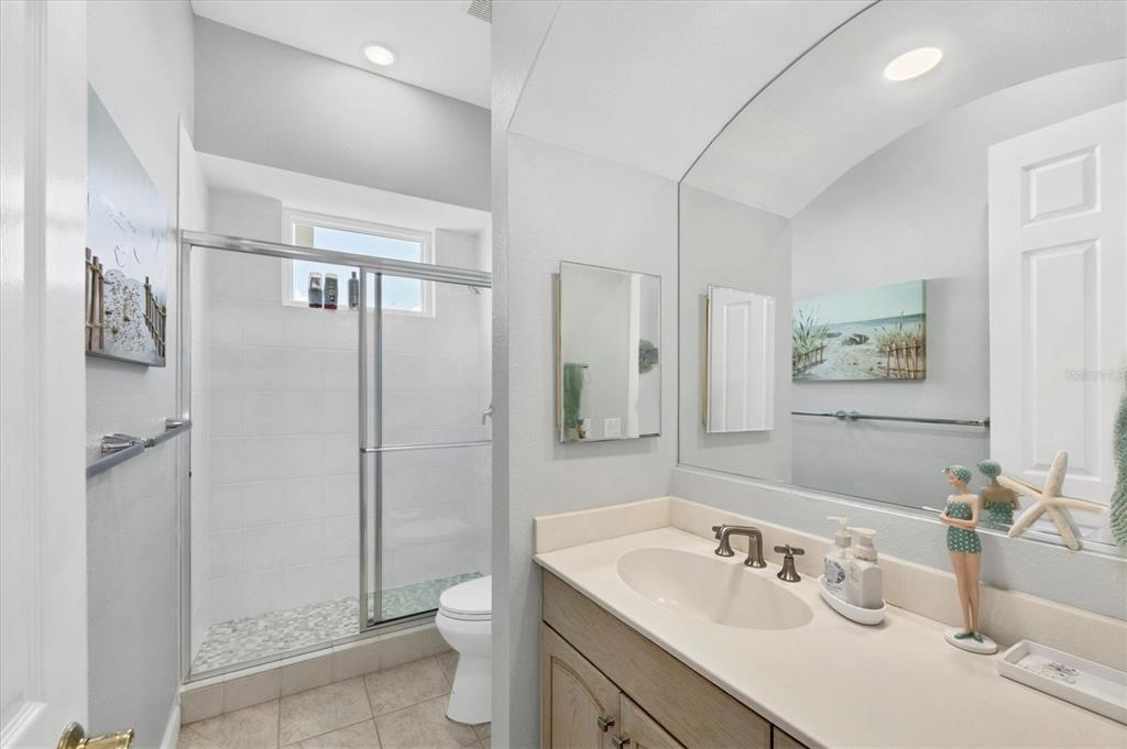 71 North Gulf Boulevard Placida, FL 33946 - Photo 30 of 52 a bathroom with a sink toilet and shower