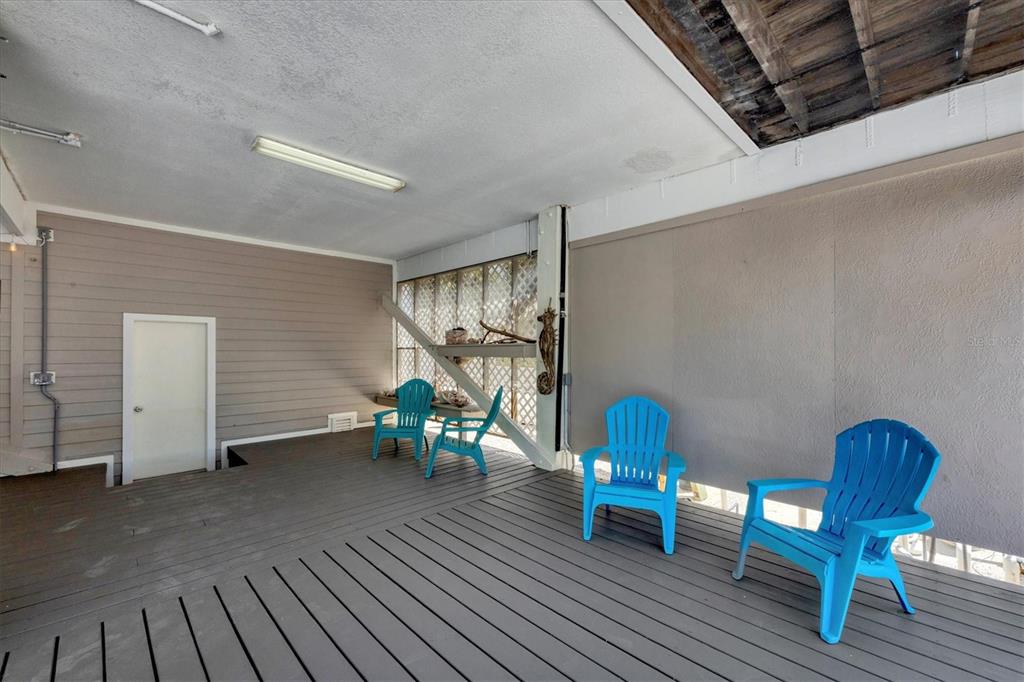 71 North Gulf Boulevard Placida, FL 33946 - Photo 38 of 52 a dining room with furniture and wooden floor