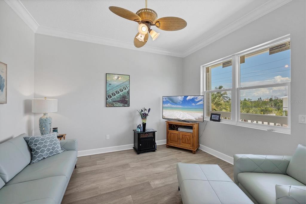 71 North Gulf Boulevard Placida, FL 33946 - Photo 42 of 52 a living room with furniture a fireplace and a window