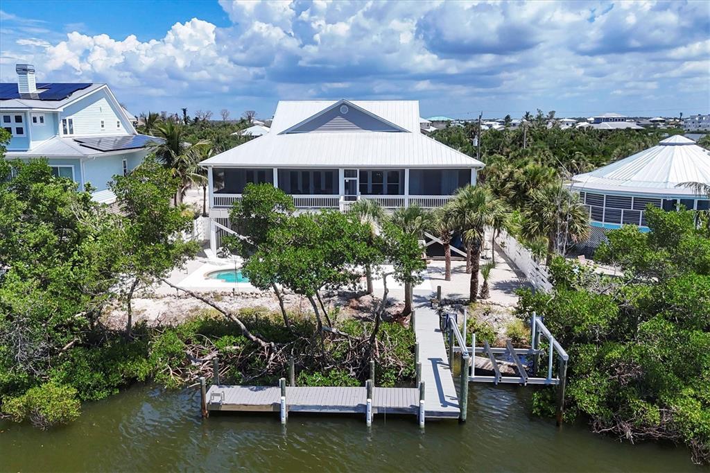71 North Gulf Boulevard Placida, FL 33946 - Photo 50 of 52 an aerial view of a house with a garden and a yard