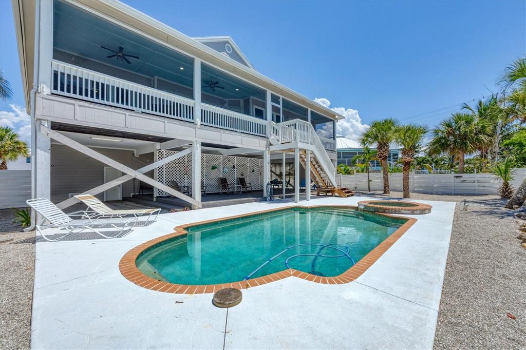 71 North Gulf Boulevard Placida, FL 33946 - Photo 6 of 52 a view of a swimming pool with a house in the background