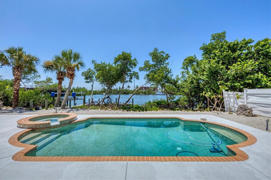 71 North Gulf Boulevard Placida, FL 33946 - Photo 7 of 52 a view of a swimming pool with a yard