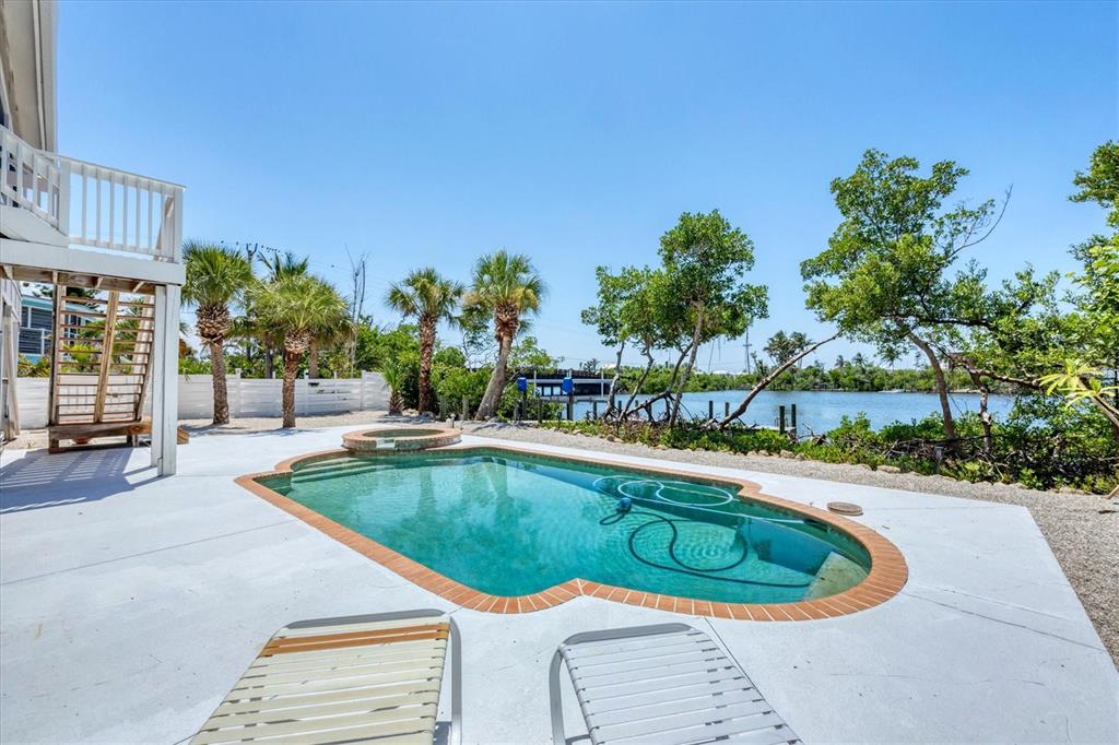 71 North Gulf Boulevard Placida, FL 33946 - Photo 8 of 52 a swimming pool with outdoor seating and yard