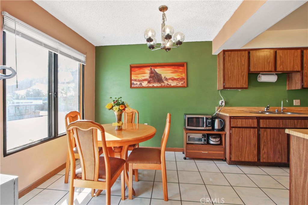 4501 Peck Road, Unit 23 El Monte, CA 91732 - Photo 3 of 12 a view of a dining room with furniture and a chandelier