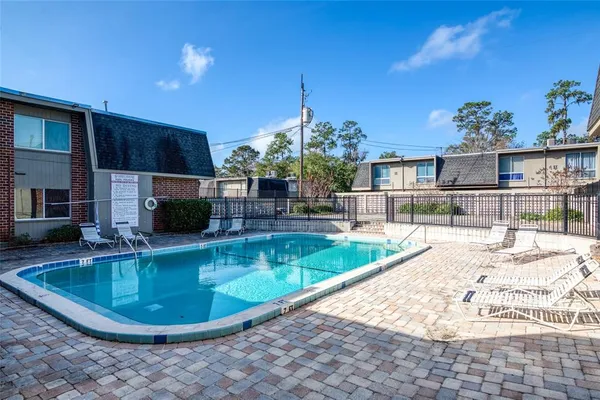 a view of a swimming pool with a patio