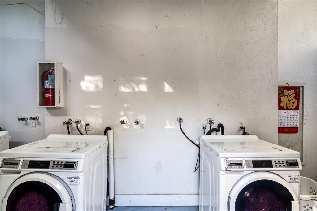 1700 Southwest 16th Court, Unit J4 Gainesville, FL 32608 - Photo 20 of 21 a utility room with dryer and washer
