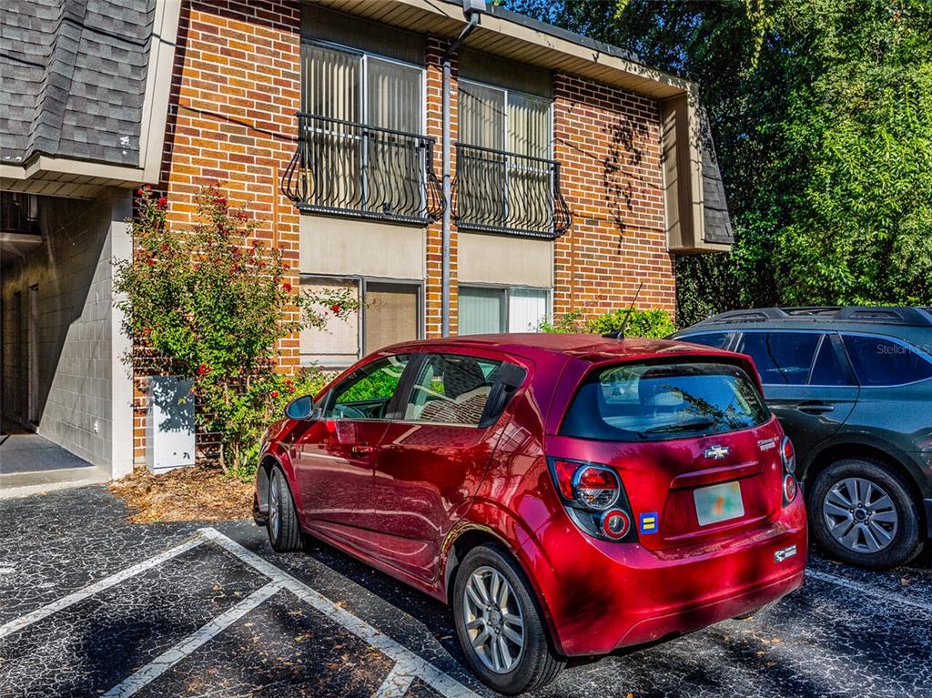 1700 Southwest 16th Court, Unit J4 Gainesville, FL 32608 - Photo 21 of 21 a front view of a house with parking space