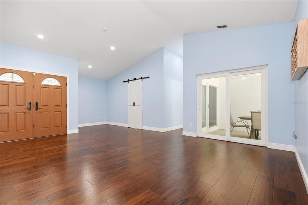 7432 Sparkling Lake Road Orlando, FL 32819 - Photo 5 of 54 a view of a livingroom with wooden floor