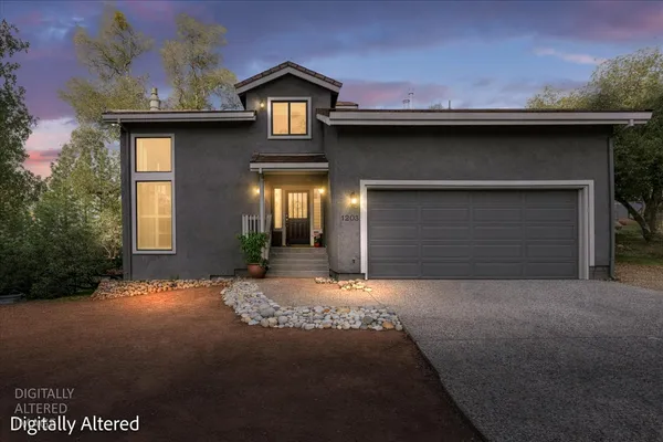 a front view of a house with yard