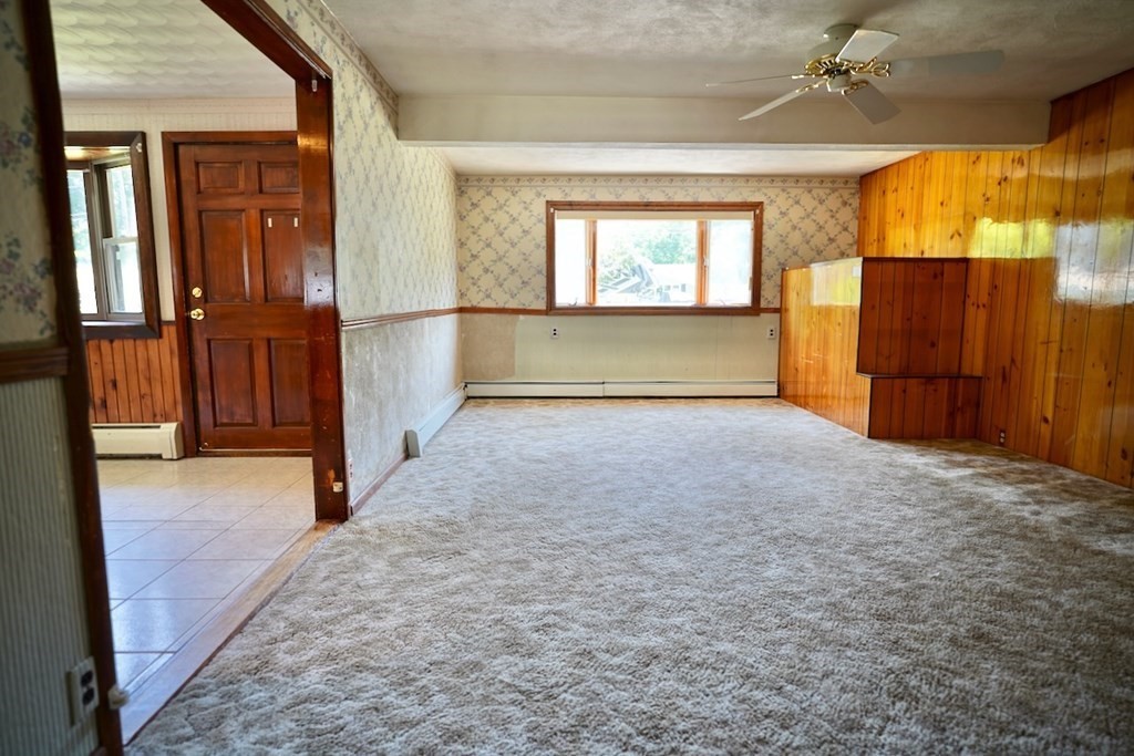 8 Dondi Road Beverly, MA 01915 - Photo 14 of 29 a view of empty room with a fireplace and windows