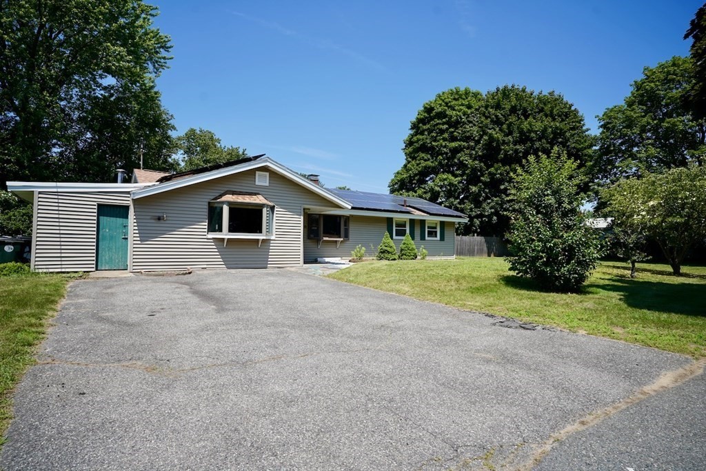 8 Dondi Road Beverly, MA 01915 - Photo 2 of 29 a front view of a house with a garden and yard