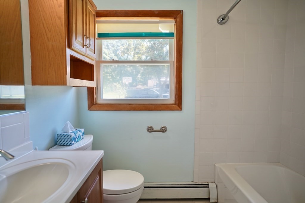 8 Dondi Road Beverly, MA 01915 - Photo 21 of 29 a bathroom with a sink a toilet and tub