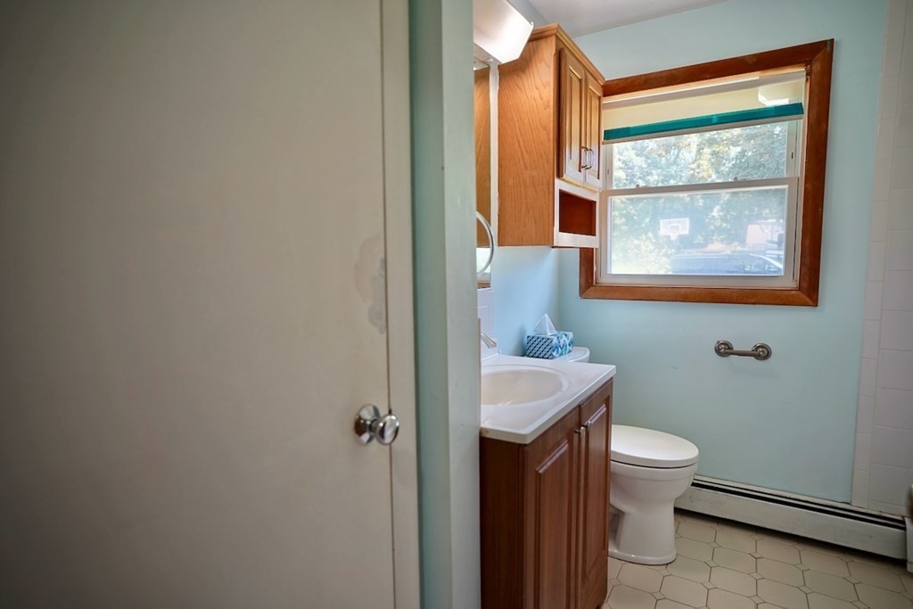 8 Dondi Road Beverly, MA 01915 - Photo 22 of 29 a bathroom with a toilet sink and mirror
