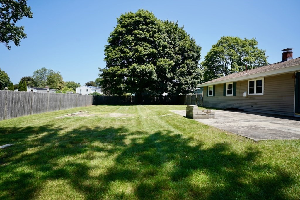 8 Dondi Road Beverly, MA 01915 - Photo 24 of 29 a view of a house with a backyard