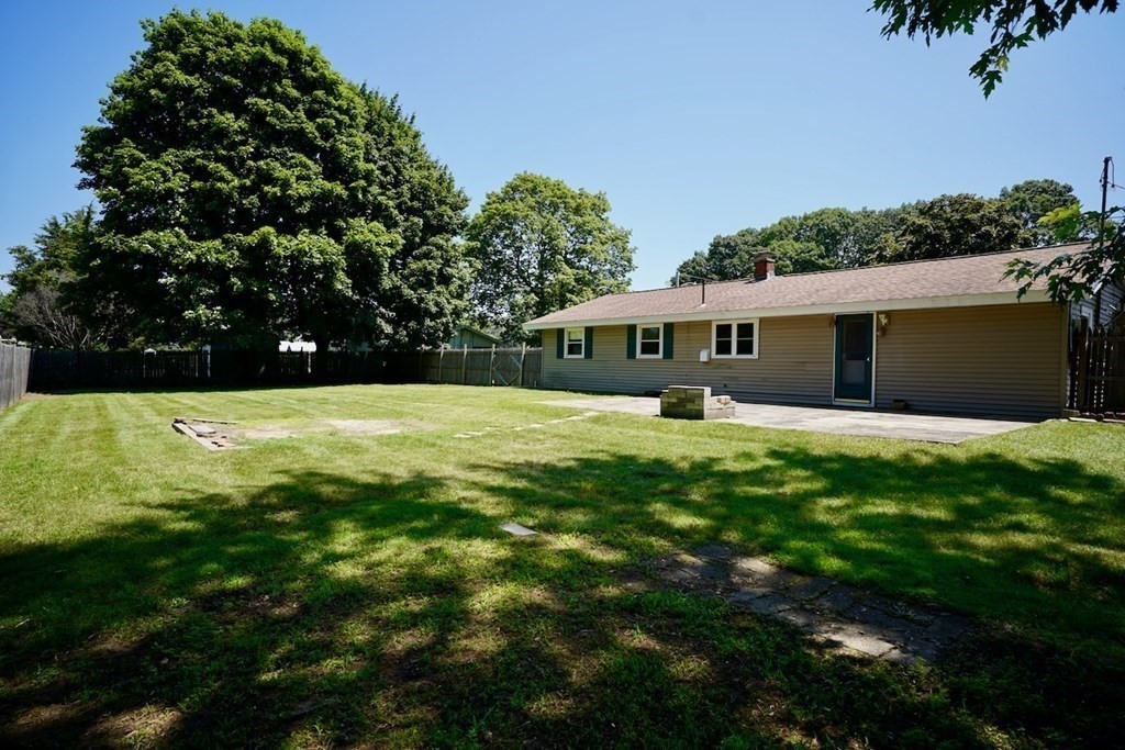 8 Dondi Road Beverly, MA 01915 - Photo 27 of 29 a view of an house with swimming pool and a yard