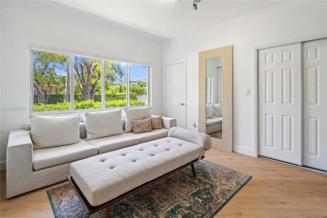 a living room with furniture and a rug