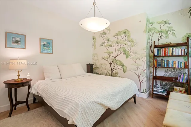 a bedroom with a bed and a table in it