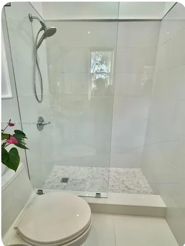 a bathroom with a sink and a shower