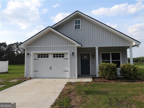 5915 Rye Patch Road Ludowici, GA 31316 - Photo 20 of 25 a view of a house with backyard and garden