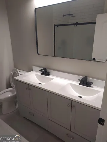a bathroom with a sink and a toilet