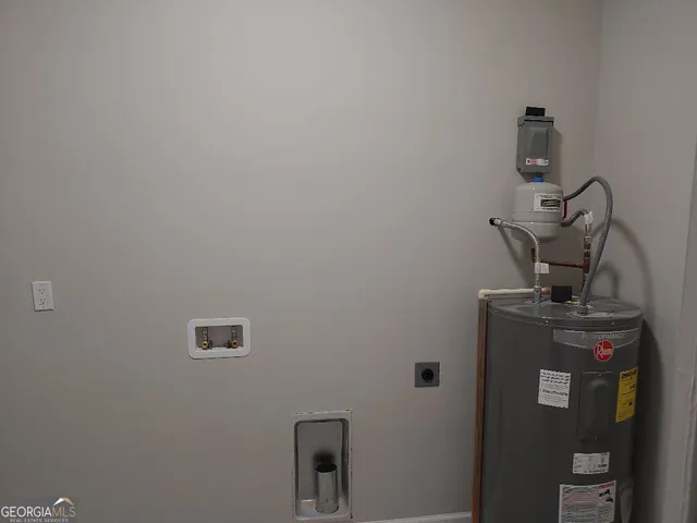 a view of storage and utility room with washer and dryer
