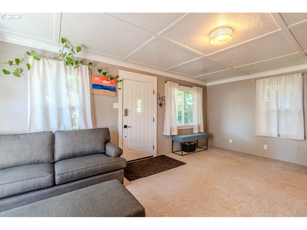 105 Northwest 13th Street Gresham, OR 97030 - Photo 25 of 45 a living room with furniture and a chandelier