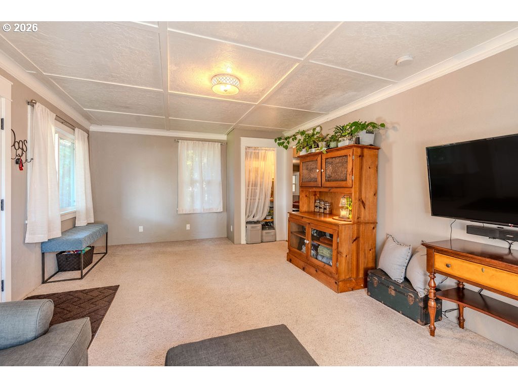 105 Northwest 13th Street Gresham, OR 97030 - Photo 26 of 45 a living room with furniture and a flat screen tv