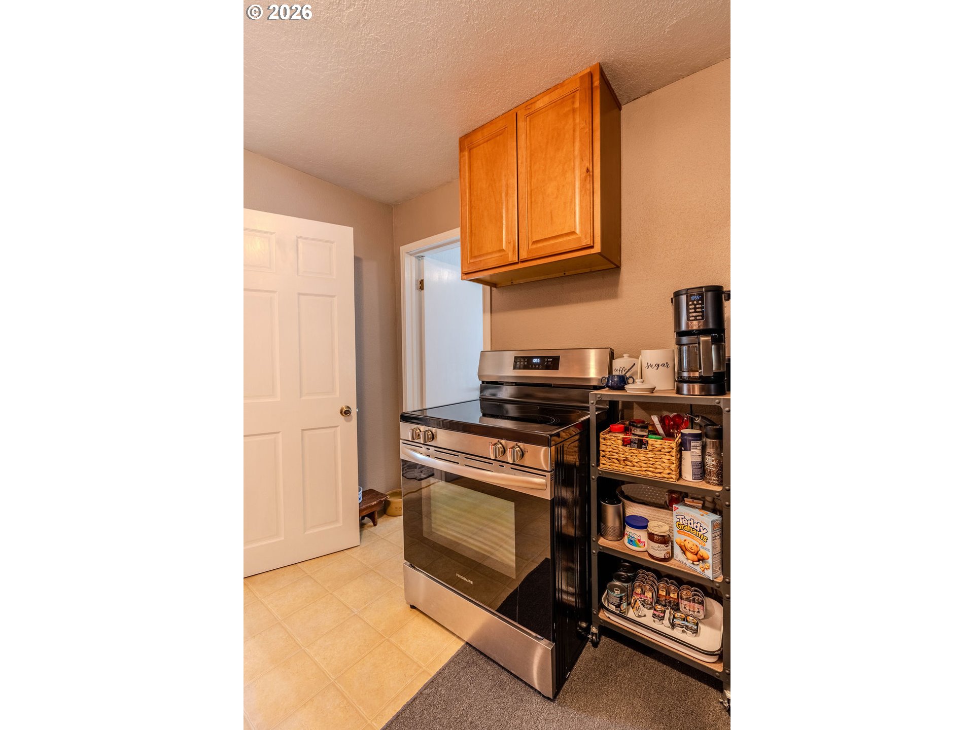 105 Northwest 13th Street Gresham, OR 97030 - Photo 36 of 45 a kitchen with stainless steel appliances a stove and a microwave