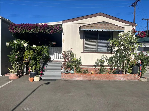 a view of a house with a street