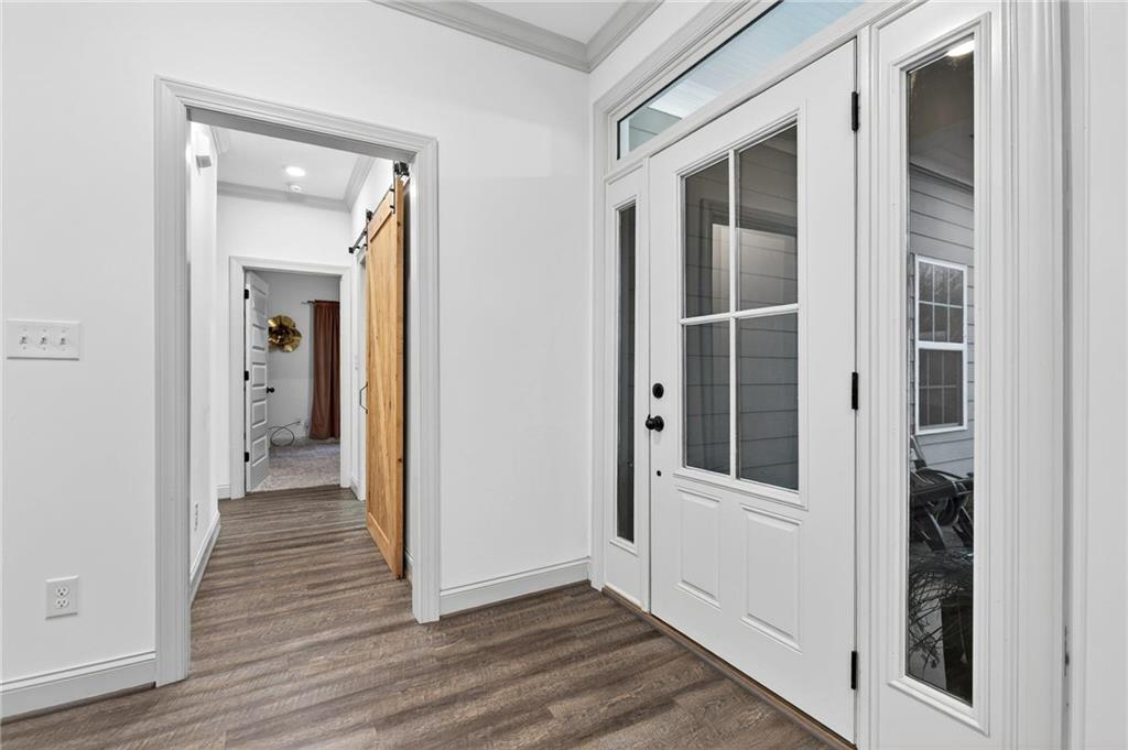 4 Tahlequah Street Northeast Rome, GA 30161 - Photo 11 of 52 a view of a hallway with wooden floor and closet