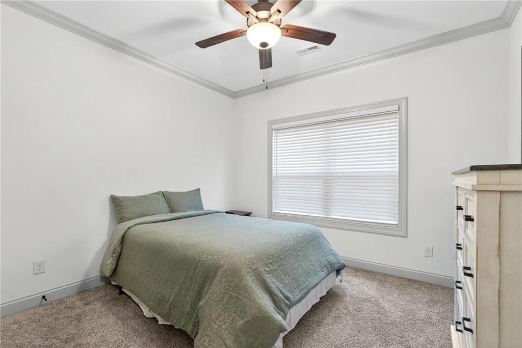 4 Tahlequah Street Northeast Rome, GA 30161 - Photo 17 of 52 a bedroom with a bed and window