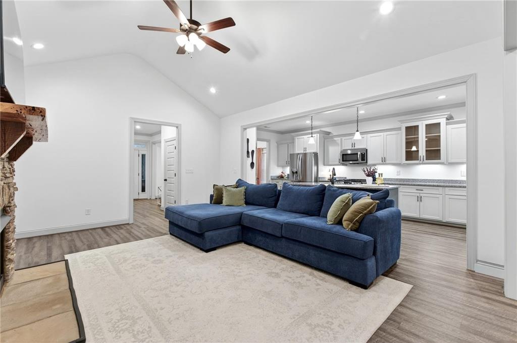 4 Tahlequah Street Northeast Rome, GA 30161 - Photo 23 of 52 a living room with furniture kitchen view and a chandelier