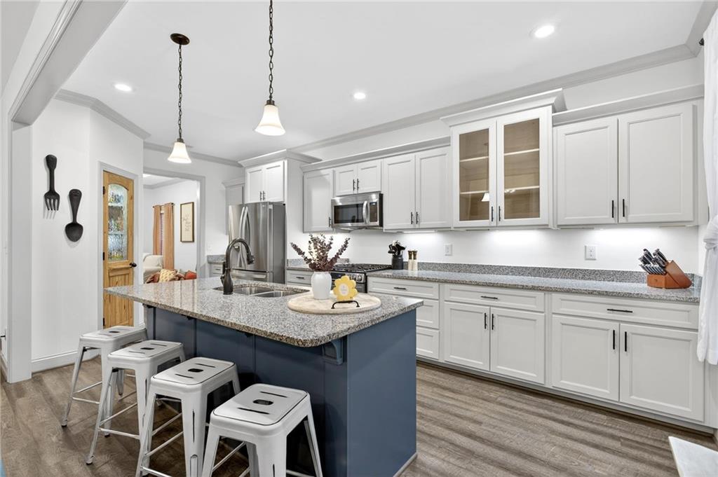 4 Tahlequah Street Northeast Rome, GA 30161 - Photo 28 of 52 a kitchen with a sink stove and microwave