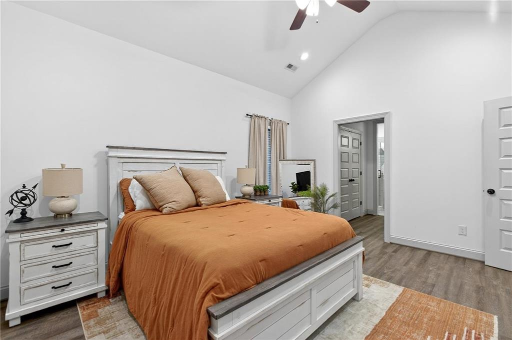 4 Tahlequah Street Northeast Rome, GA 30161 - Photo 36 of 52 a bedroom with a bed and wooden floor