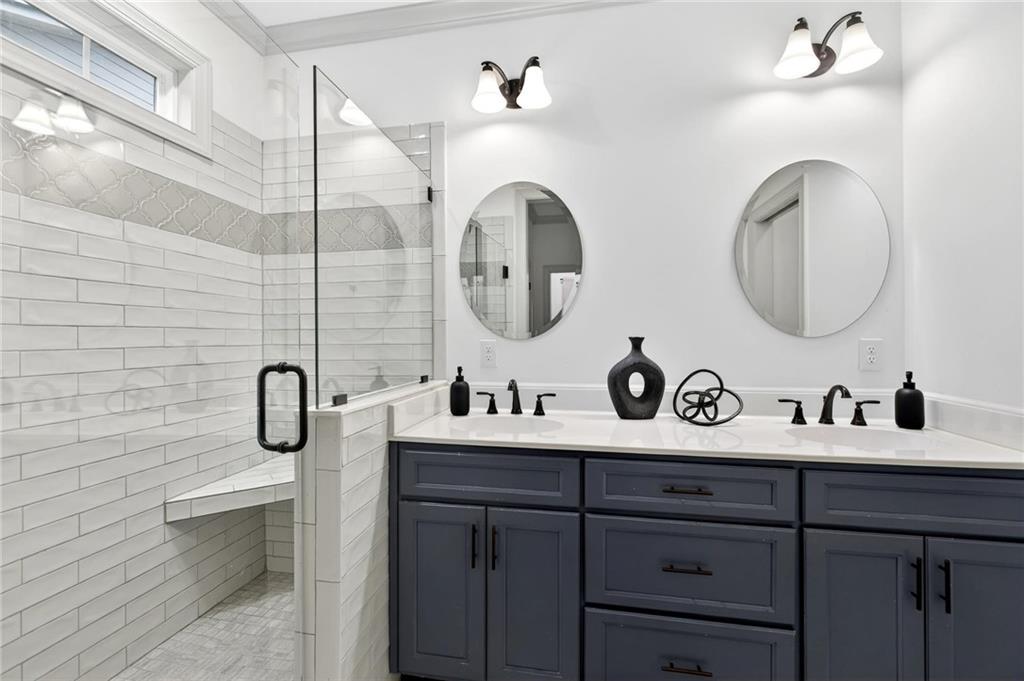 4 Tahlequah Street Northeast Rome, GA 30161 - Photo 40 of 52 a bathroom with a double vanity sink mirror and toilet