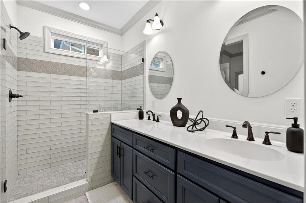 4 Tahlequah Street Northeast Rome, GA 30161 - Photo 41 of 52 a bathroom with a double vanity sink and a mirror