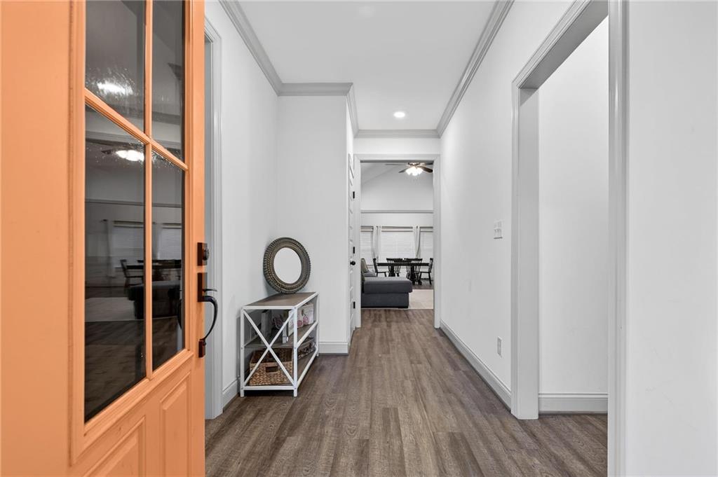 4 Tahlequah Street Northeast Rome, GA 30161 - Photo 9 of 52 a view of a hallway with a view of living room with wooden floor