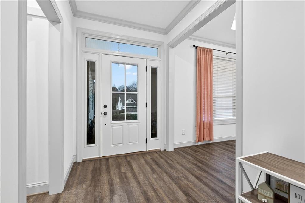 4 Tahlequah Street Northeast Rome, GA 30161 - Photo 10 of 52 an empty room with wooden floor and windows